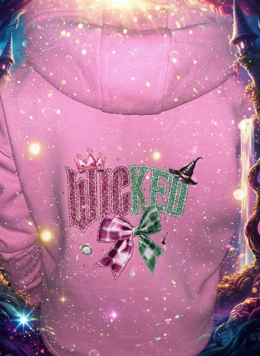 Pink hoodie with decorative design on a dark background