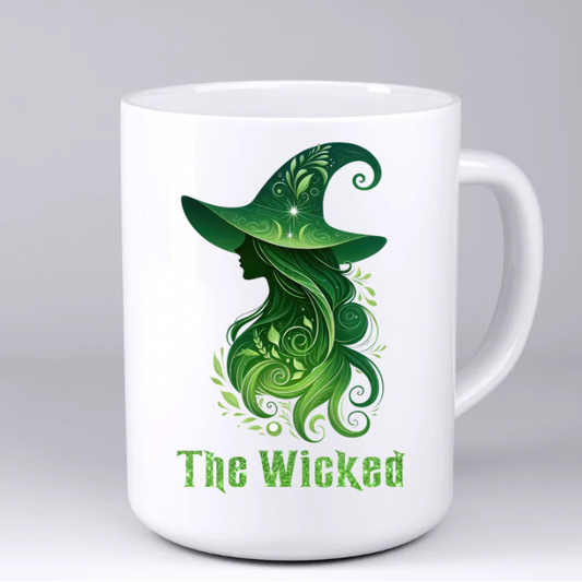 White mug with green witch design and 'The Wicked' text on a white background
